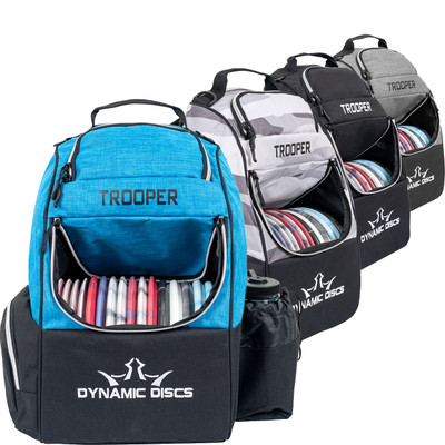 Dynamic Discs TROOPER BACKPACK Bag for Disc Golf - four color options of the bag lined up in a row with the blue and black one facing forward, flap open showing discs inside.